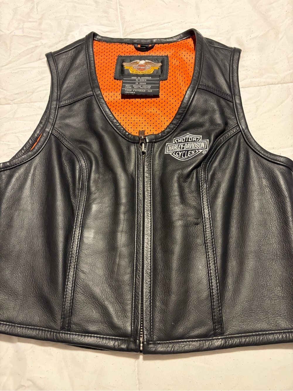 NWOT. Harley-Davidson Women’s Black Leather Vest with Orange Lining.